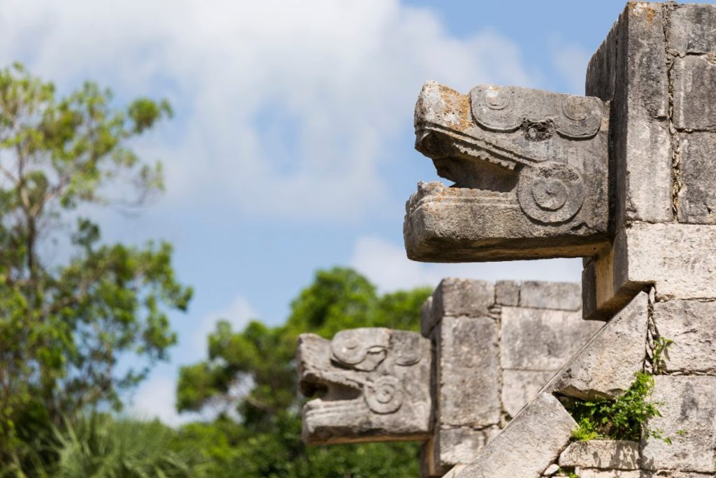 Snake head detail on a temple in Chichen Itza