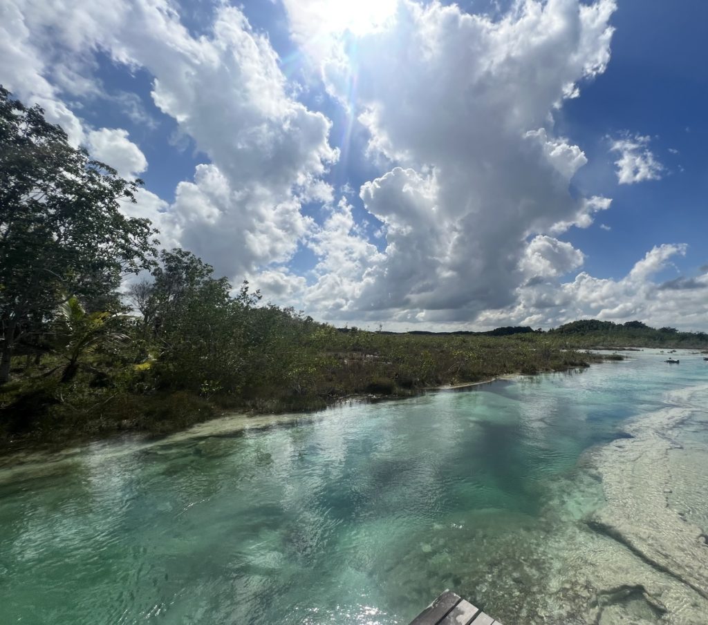 A photo showing the blue waters and stromatolites at Los Rapidos, Bacalar