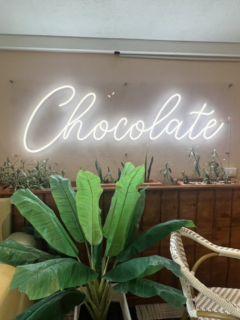 chocolate led sign at cacoa cafe, Xela
