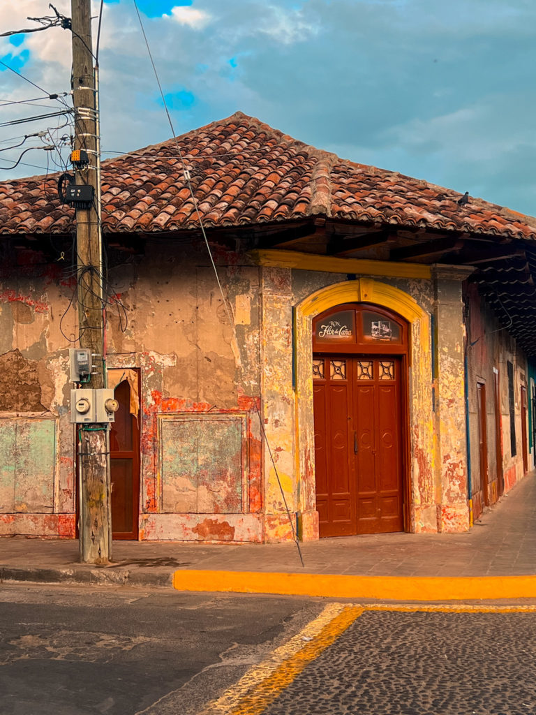 photo of street corner in Granada Nicaragua, showing distressed walls