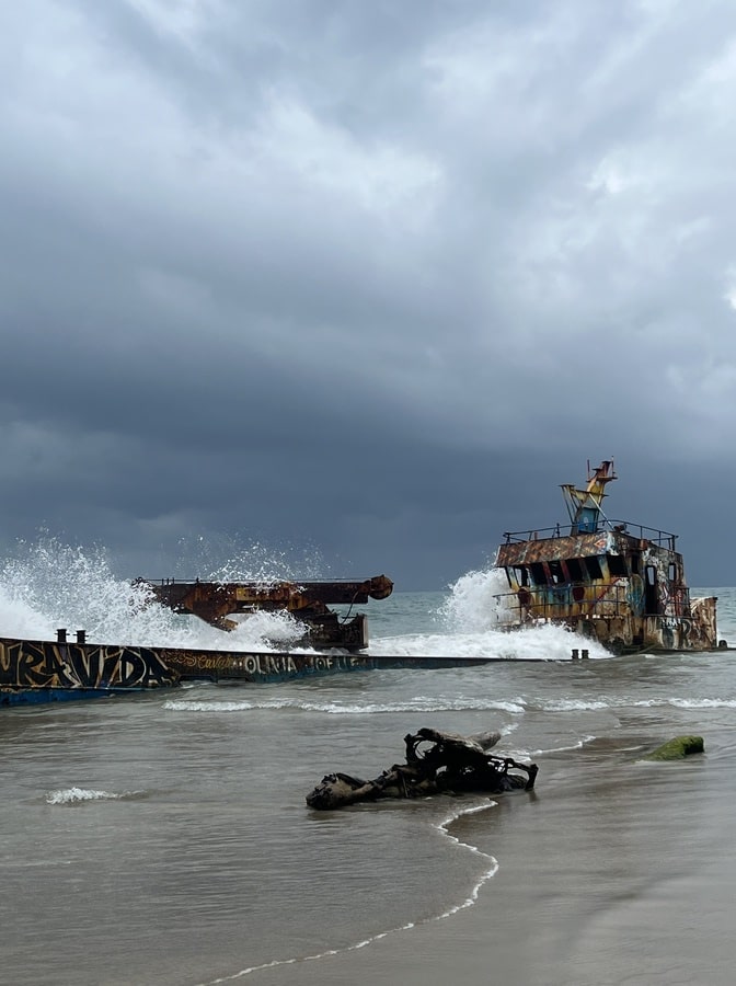 photo of a shipwreck in a cloudy sky