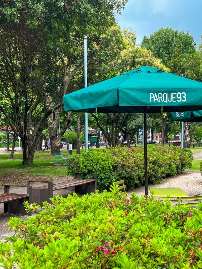 photo of parque 93 with greenery and umbrella in view