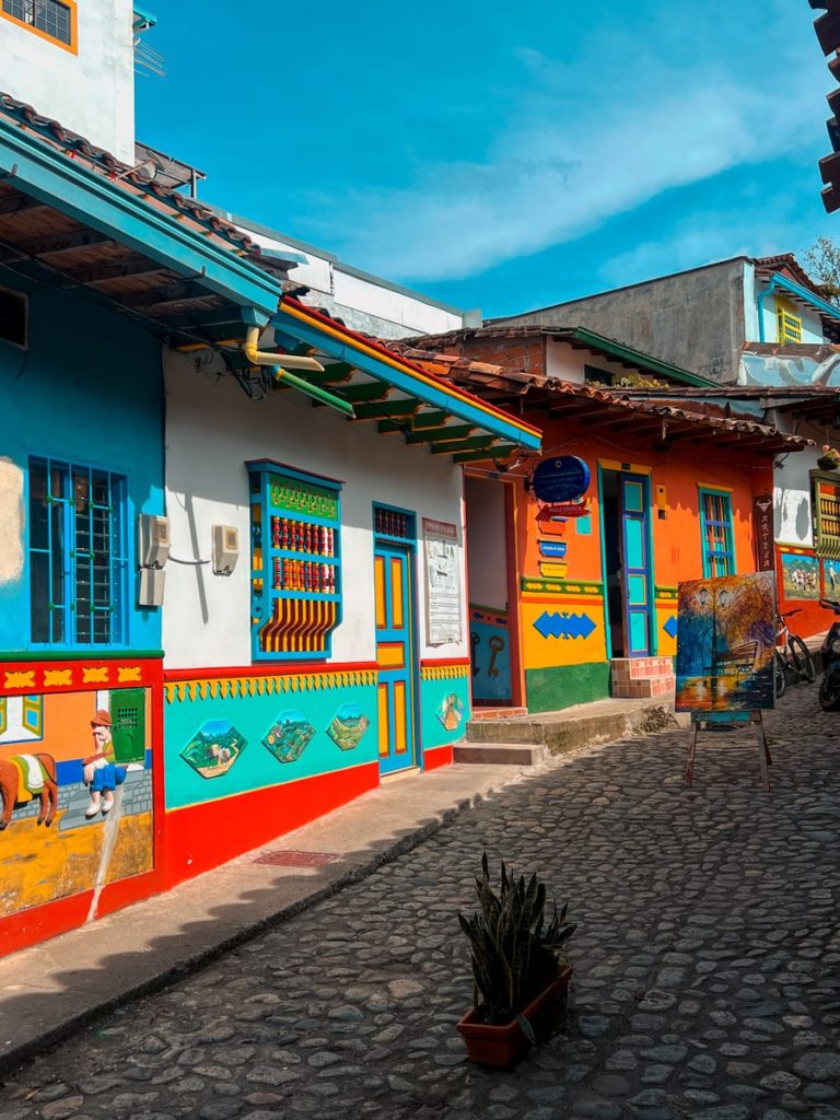 photo of vibrant and colourful buildings in guatape town, with painted imaged and details