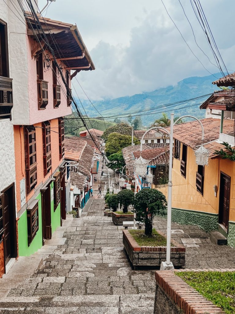 photo of cobbled stairs lined with colourful buildings in jerico, colombia