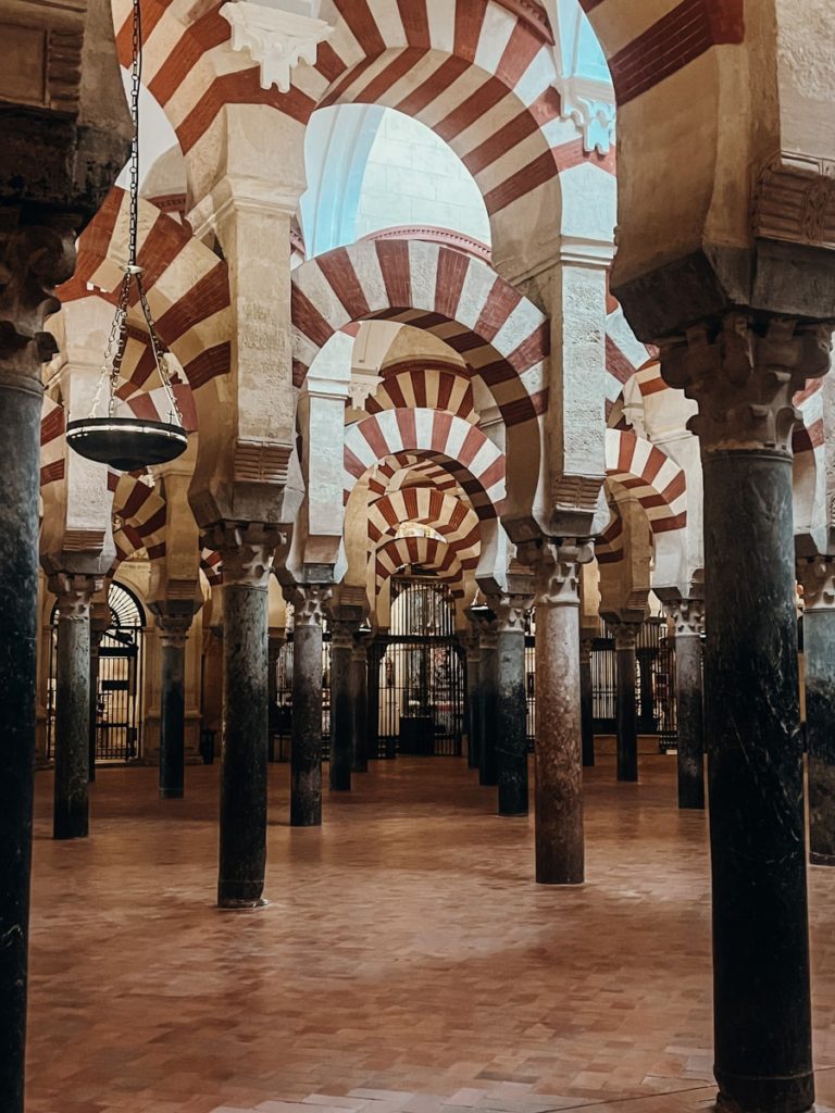 photo of mesquita cathedral of cordoba and their intricate archways