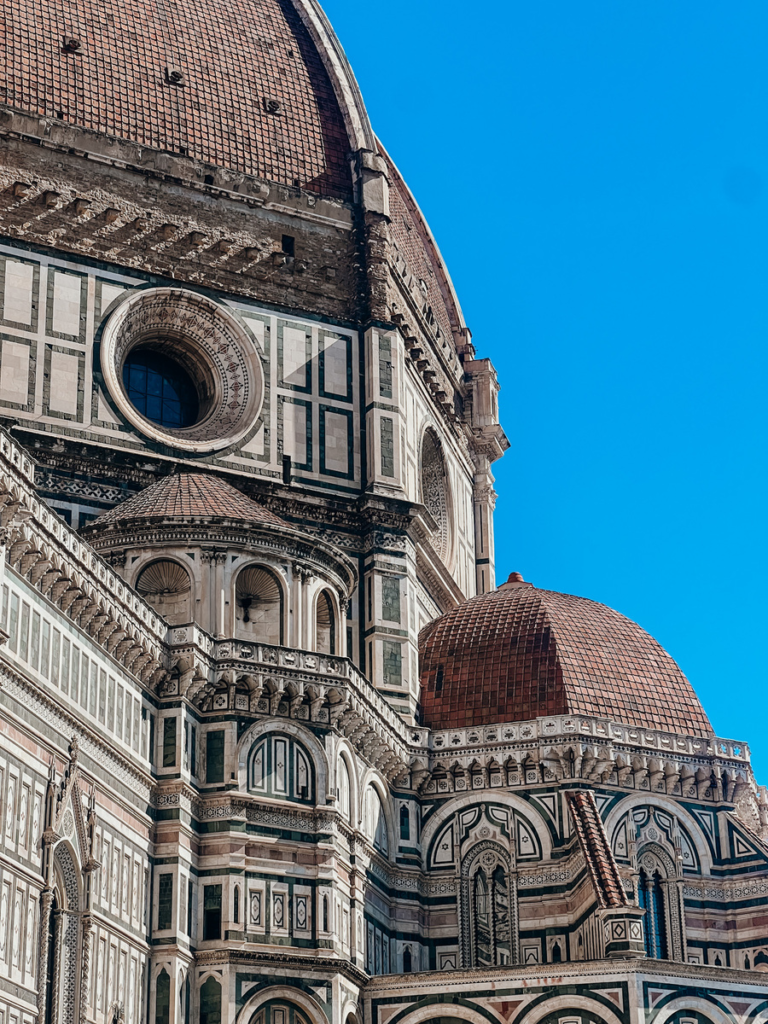 close up photo of the detailing on the Cathedral of Santa Maria del Fiore in Florence